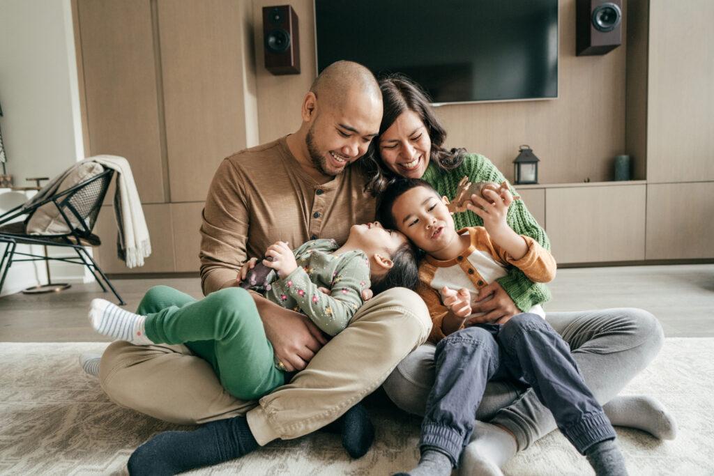 Family in a living room breathing clean, HEPA-filtered air